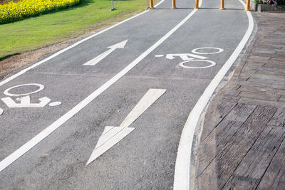 Close-up of arrow symbol on road