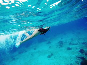 Woman swimming in sea