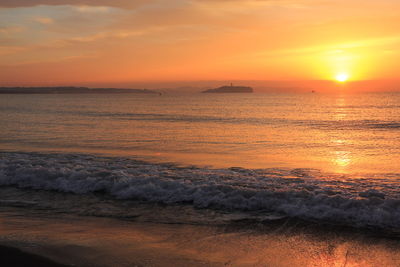 Scenic view of sea against sky during sunset