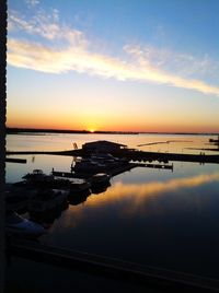 Scenic view of calm lake at sunset