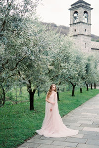 Rear view of woman standing in park