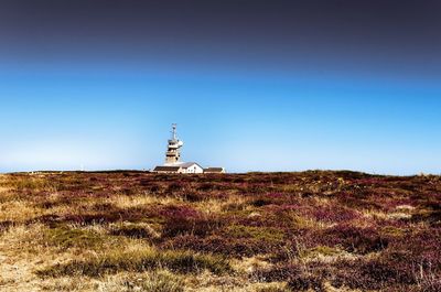 Built structure on field against clear sky