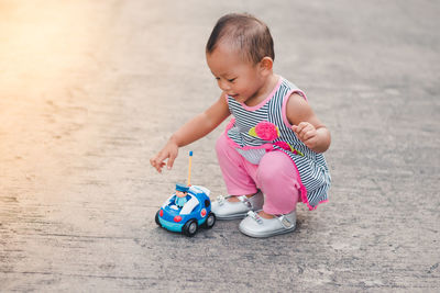 Cute boy playing with toy