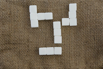 Close-up of arrow symbol on paper