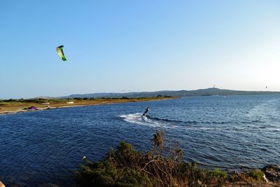 Hot air balloon flying over sea