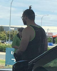 Man standing on road against sky