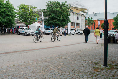 People walking on street in city