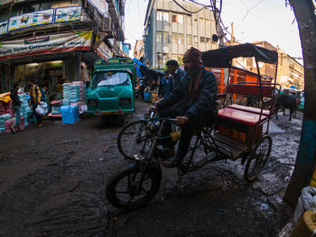 People riding bicycle on road