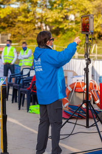 Rear view of man photographing