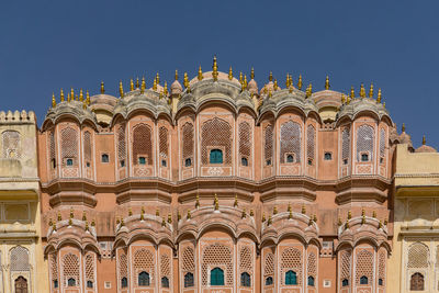 Low angle view of building against blue sky