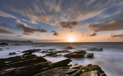 Scenic view of sea against sky during sunset