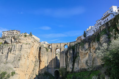 Low angle view of historical building against blue sky