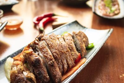 Close-up of meat served in plate on table