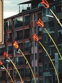 Low angle view of illuminated buildings in city