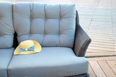High angle view of sun hat on sofa at home