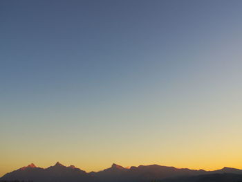 Scenic view of mountains at sunset