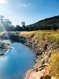 Scenic view of river against sky