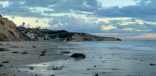 View of calm beach against the sky