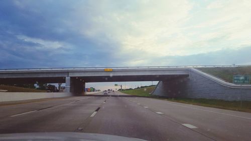 View of highway through car windshield