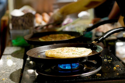 Cropped hand preparing food