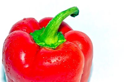 Close-up of strawberry over water against white background