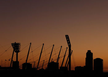 Silhouette of built structure at sunset