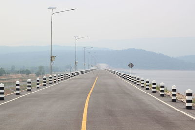 View of road and bridge against sky