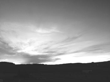 Scenic view of landscape against cloudy sky