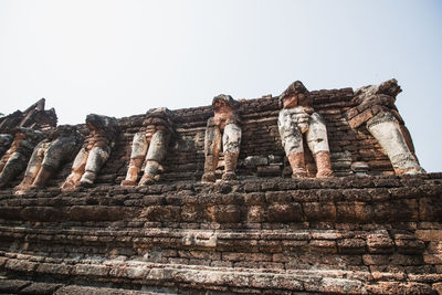 Low angle view of old temple against sky