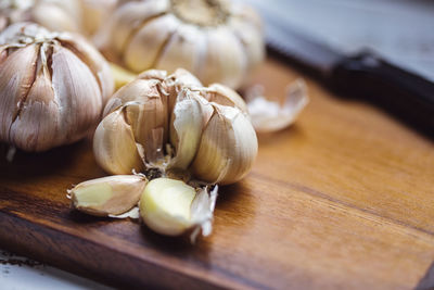 Close-up of garlic on cutting board