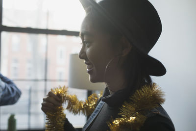 A young woman wearing tinsel