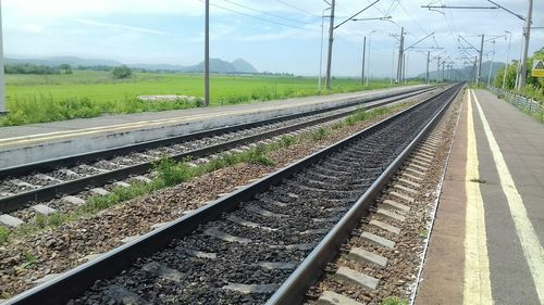 Railroad tracks against sky