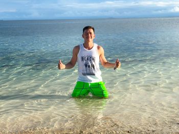 Full length of man on beach against sky