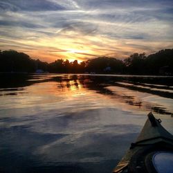 Scenic view of lake at sunset