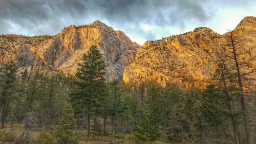 Scenic view of mountains against cloudy sky