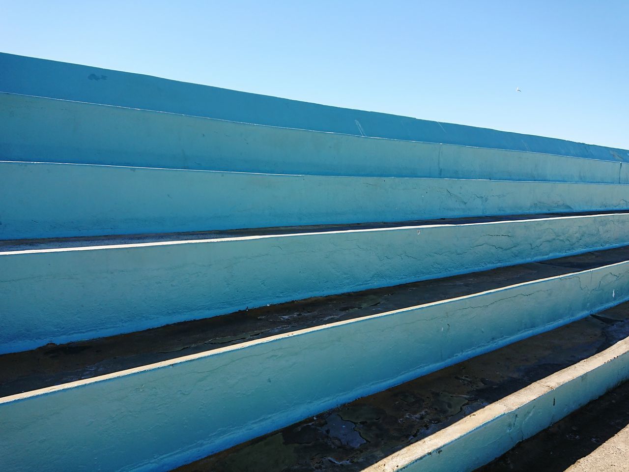 CLOSE-UP OF METALLIC STRUCTURE AGAINST SKY