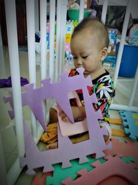 Boy playing with toy at home