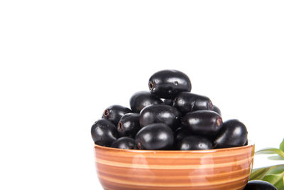 Close-up of black tea against white background