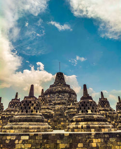 Panoramic view of temple building against sky at borobudur, magelang, yogyakarta, indonesia