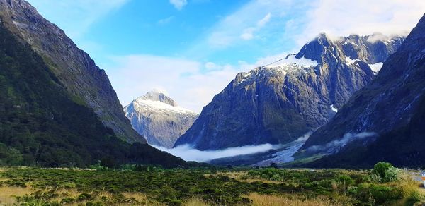 Panoramic view of snowcapped mountains against sky