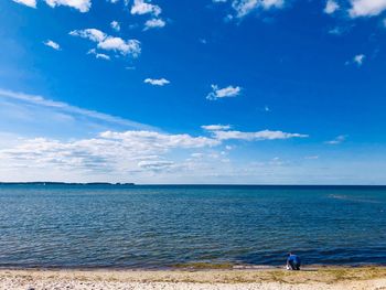 Scenic view of sea against blue sky