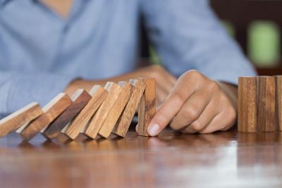 Close-up of hand holding wood