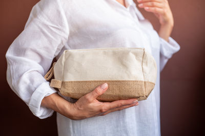Midsection of woman holding gift