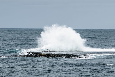 Waves splashing on rocks