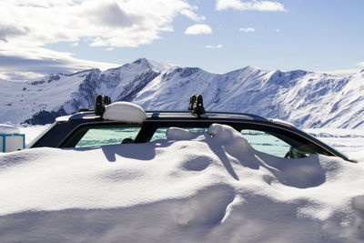 Snow covered mountains against sky