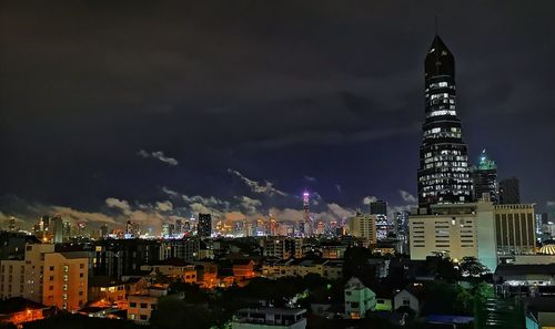 Illuminated buildings in city at night