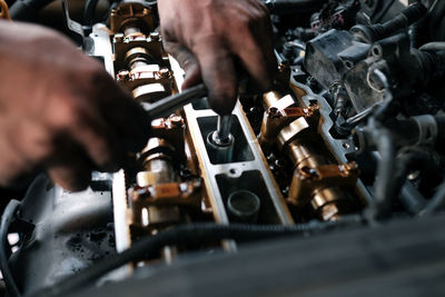 Midsection of man working at machine