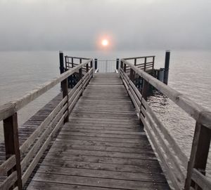 Pier over sea against sky