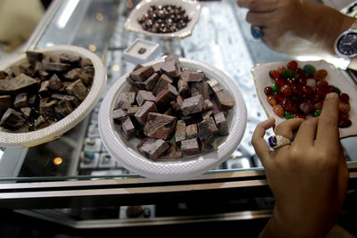 High angle view of woman preparing food on table