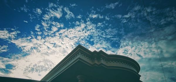 Low angle view of ornate building against sky